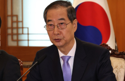 Korean court reinstates impeached PM Han as acting president